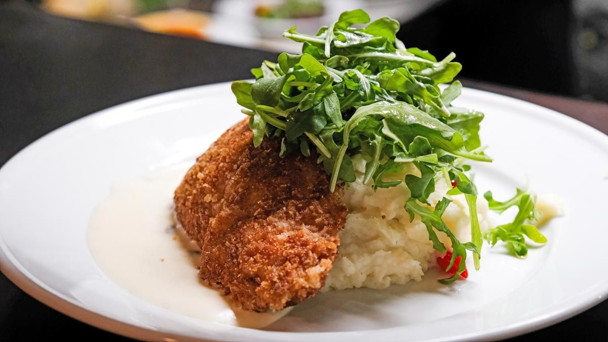 panko crusted fish with arugula and creamy risotto