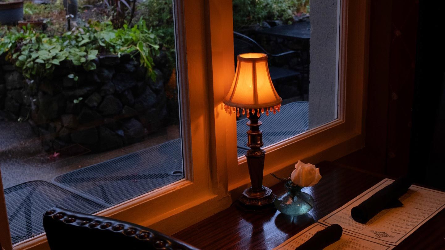 dining table with garden view at dusk